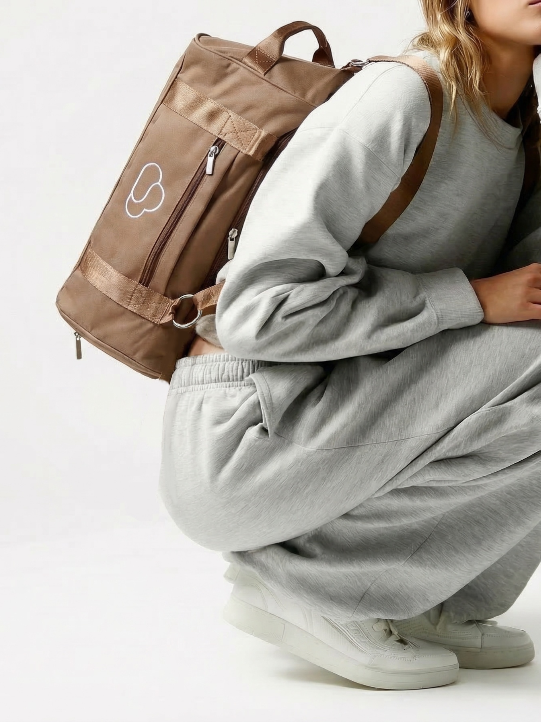 Skylaris Wanderer Duffel in Camel, backpack, side profile view
